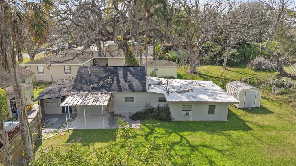 5045 Green Key Road New Port Richey, FL 34652 - Photo 27 of 32 an aerial view of a house with swimming pool garden and patio