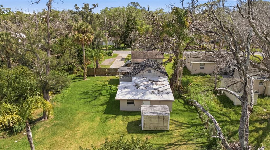 5045 Green Key Road New Port Richey, FL 34652 - Photo 28 of 32 a aerial view of a house with a yard basket ball court and outdoor seating