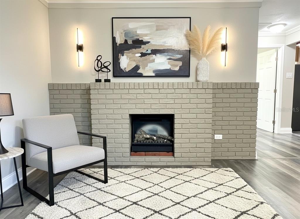 5045 Green Key Road New Port Richey, FL 34652 - Photo 5 of 32 a living room with furniture and a fireplace
