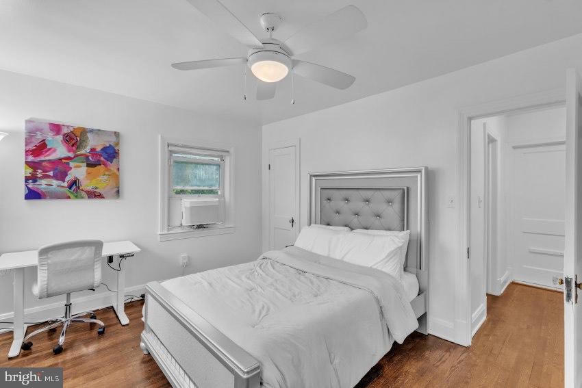 3310 Elbert Street Baltimore, MD 21229 - Photo 12 of 23 a bedroom with a bed and a chair