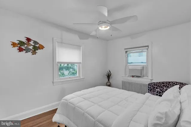 a bedroom with a large bed and a window