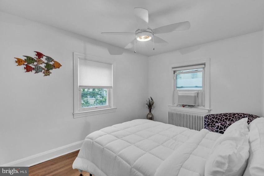 3310 Elbert Street Baltimore, MD 21229 - Photo 13 of 23 a bedroom with a large bed and a window