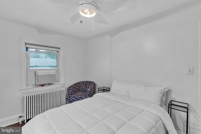 3310 Elbert Street Baltimore, MD 21229 - Photo 14 of 23 a bedroom with a bed and a window