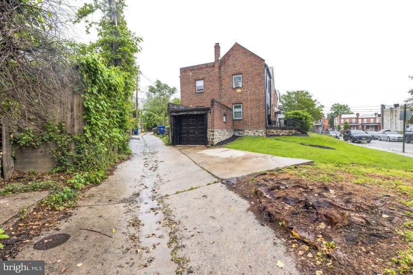 3310 Elbert Street Baltimore, MD 21229 - Photo 21 of 23 a view of a house with a yard and pathway