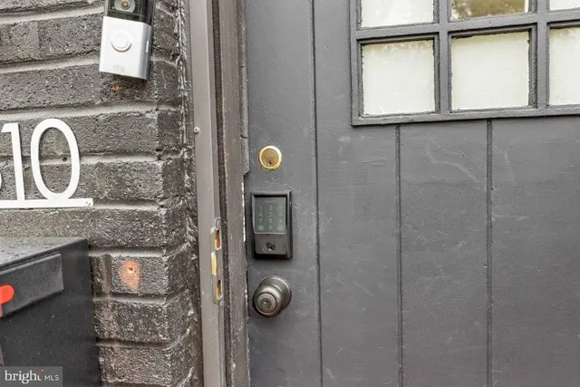 a bathroom with a granite countertop shower a mirror and a sink