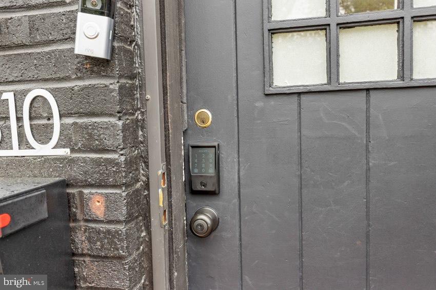 3310 Elbert Street Baltimore, MD 21229 - Photo 23 of 23 a bathroom with a granite countertop shower a mirror and a sink