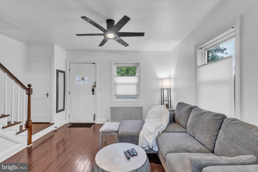 3310 Elbert Street Baltimore, MD 21229 - Photo 3 of 23 a living room with furniture and a wooden floor