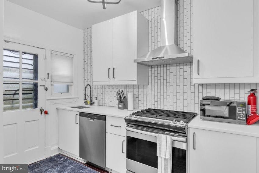 3310 Elbert Street Baltimore, MD 21229 - Photo 10 of 23 a kitchen with a stove and a sink