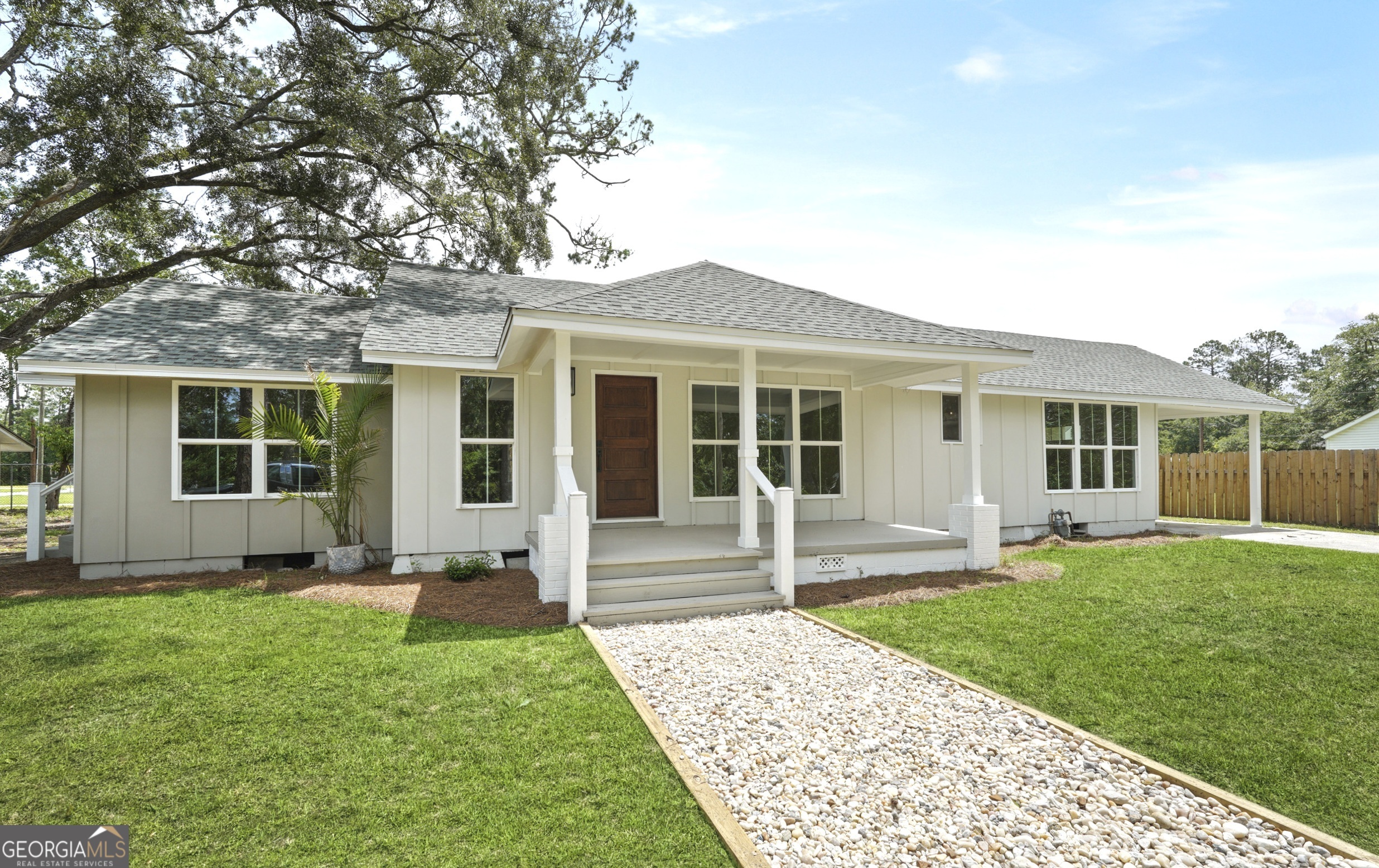 front view of a house with a yard
