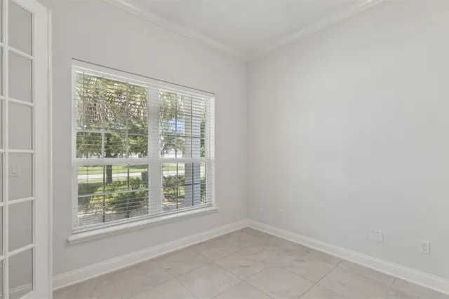 an entryway with staircase and white walls