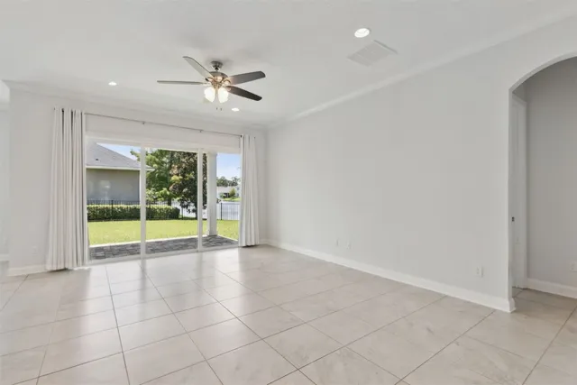 a view of a kitchen with kitchen island stainless steel appliances wooden floor and window