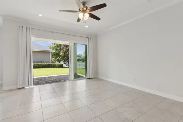 a view of kitchen with stainless steel appliances granite countertop a stove a sink a window and a living room view