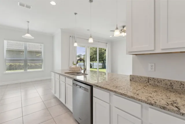 a bathroom with a sink and cabinets