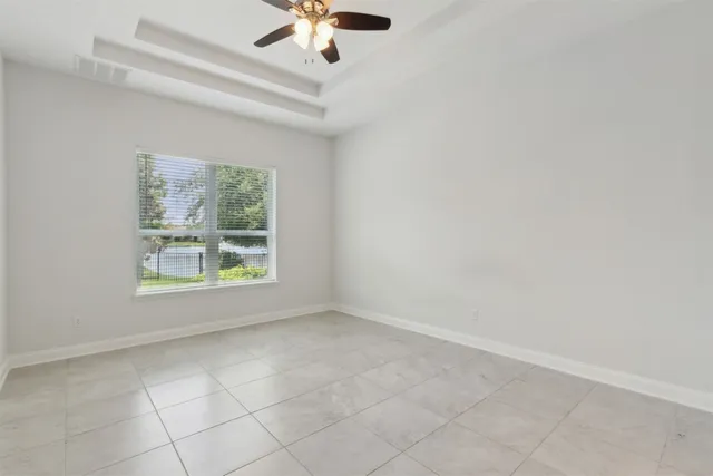 a bathroom with a double vanity sink mirror and next to a window