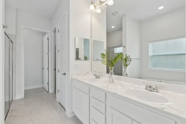 a white bath tub sitting next to a white toilet