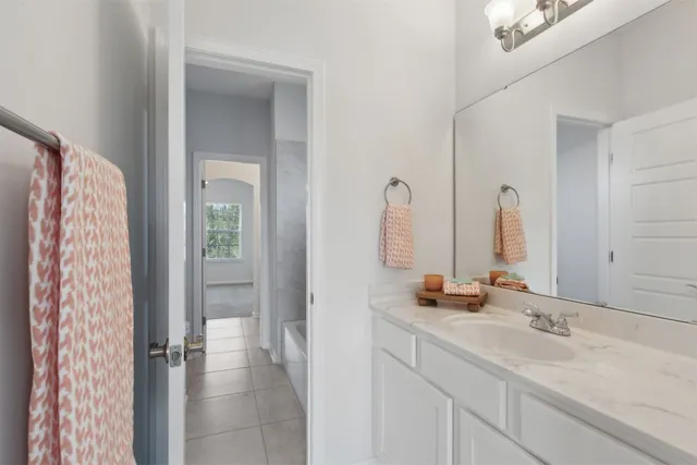 an empty room with closet and a chandelier fan