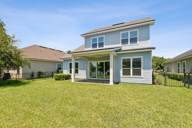 a view of a swimming pool with a table and chairs