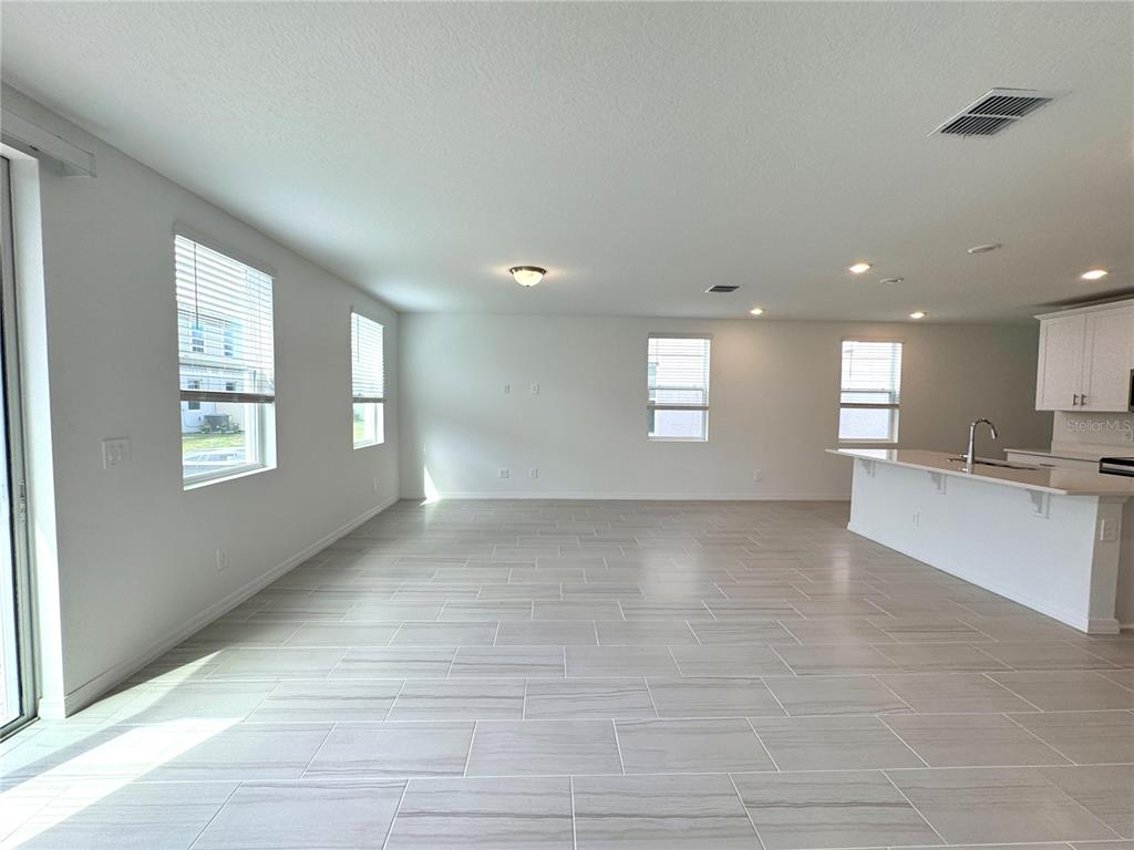 4348 Ranch House Road St. Cloud, FL 34772 - Photo 15 of 58 a view of wooden floor and windows in a room