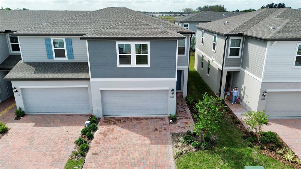 4348 Ranch House Road St. Cloud, FL 34772 - Photo 2 of 58 a front view of a house with garden