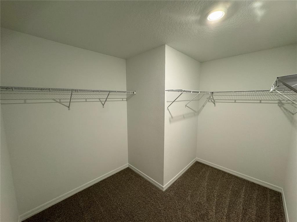 4348 Ranch House Road St. Cloud, FL 34772 - Photo 21 of 58 a view of a room with racks on the wall