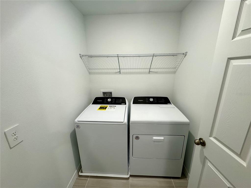 4348 Ranch House Road St. Cloud, FL 34772 - Photo 29 of 58 a utility room with dryer and washer