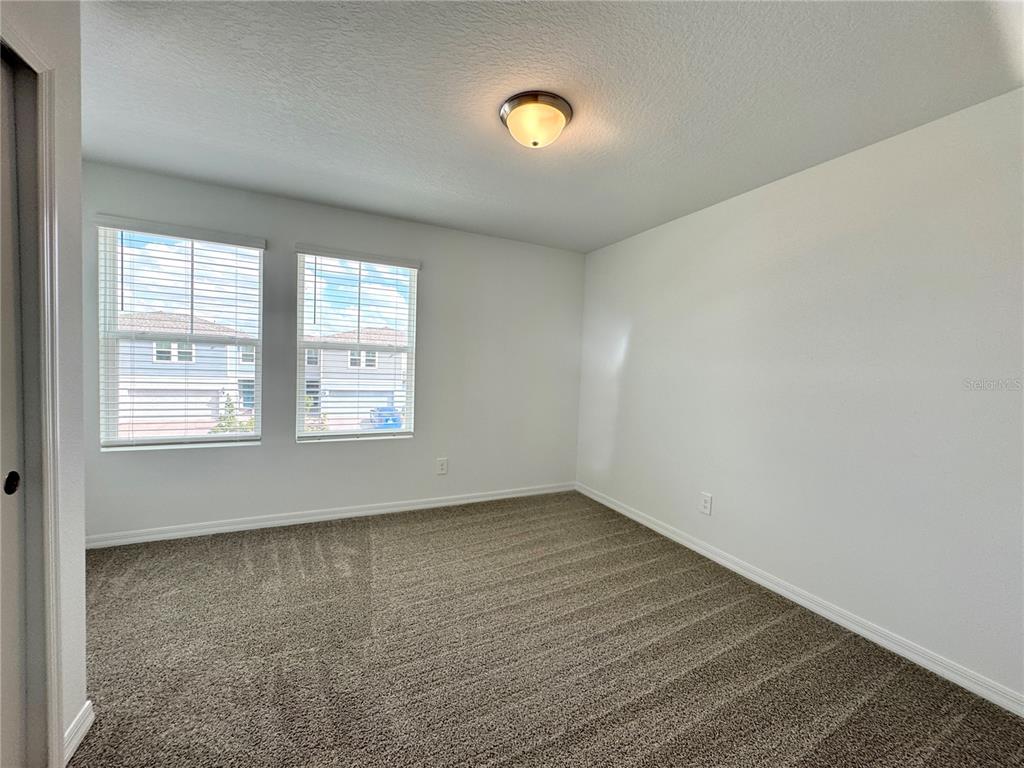 4348 Ranch House Road St. Cloud, FL 34772 - Photo 35 of 58 an empty room with windows