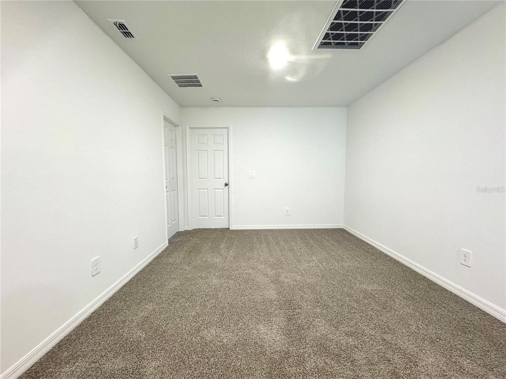 4348 Ranch House Road St. Cloud, FL 34772 - Photo 38 of 58 an empty room with a empty space and a window