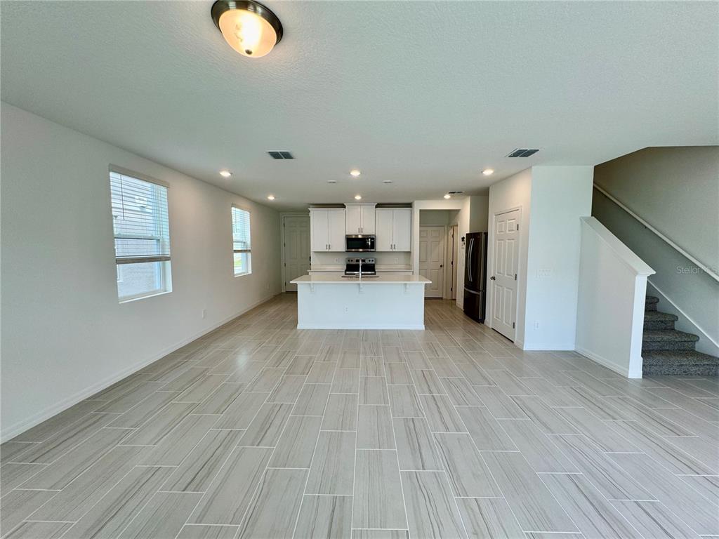 4348 Ranch House Road St. Cloud, FL 34772 - Photo 4 of 58 a view of a kitchen with wooden floor and a kitchen