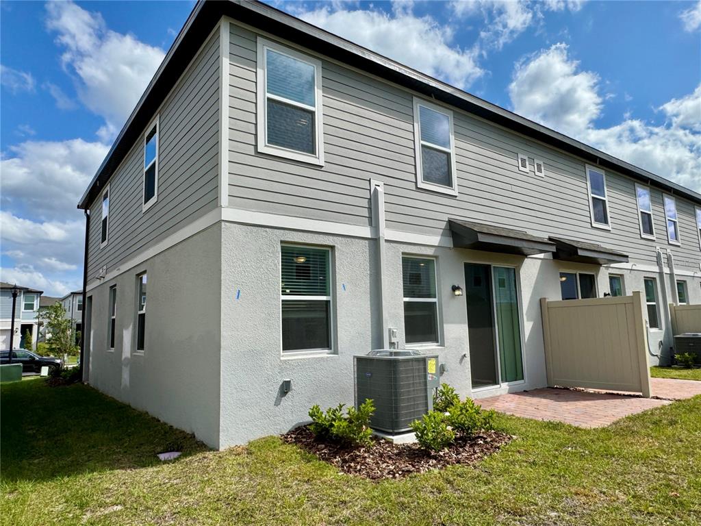 4348 Ranch House Road St. Cloud, FL 34772 - Photo 41 of 58 a front view of a house with a yard