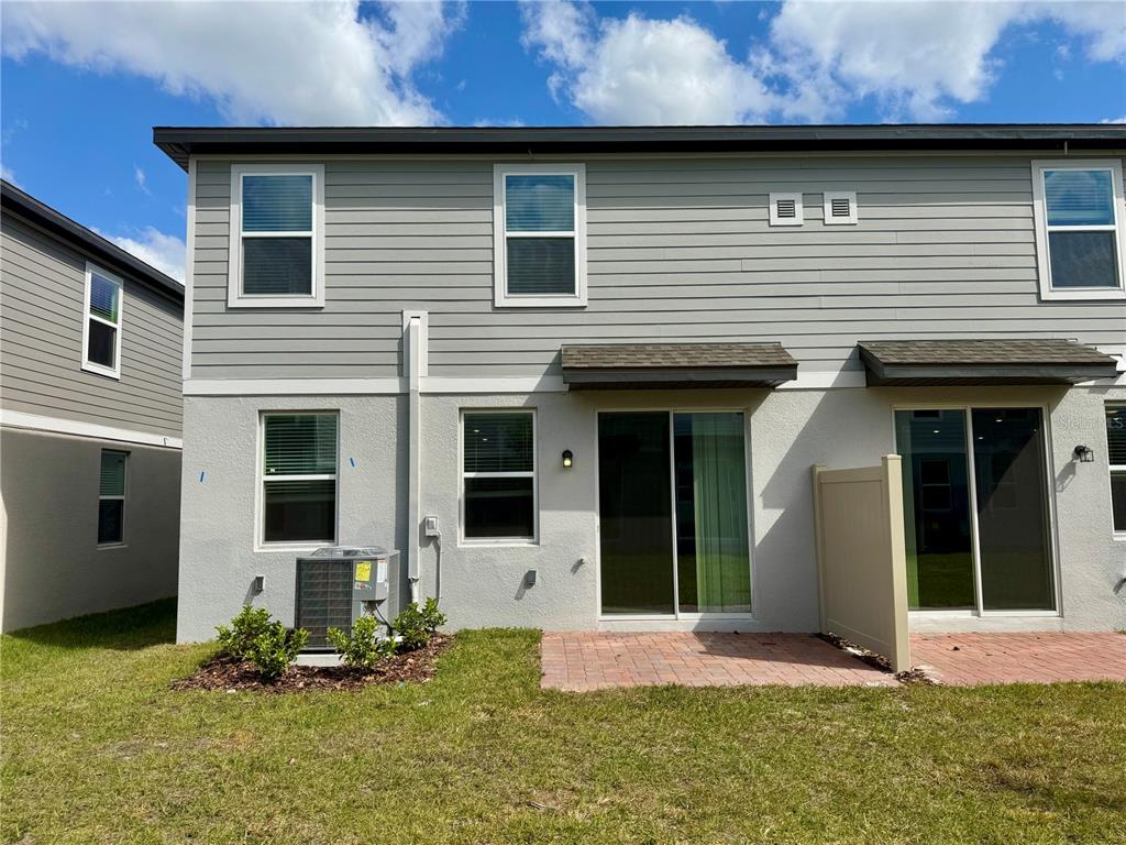 4348 Ranch House Road St. Cloud, FL 34772 - Photo 42 of 58 a front view of a house with a yard
