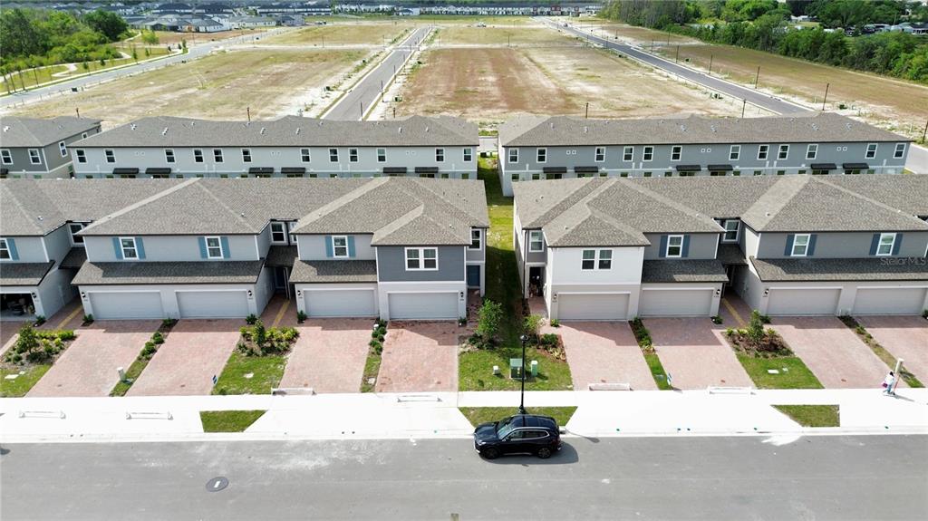 4348 Ranch House Road St. Cloud, FL 34772 - Photo 53 of 58 an aerial view of a house with swimming pool