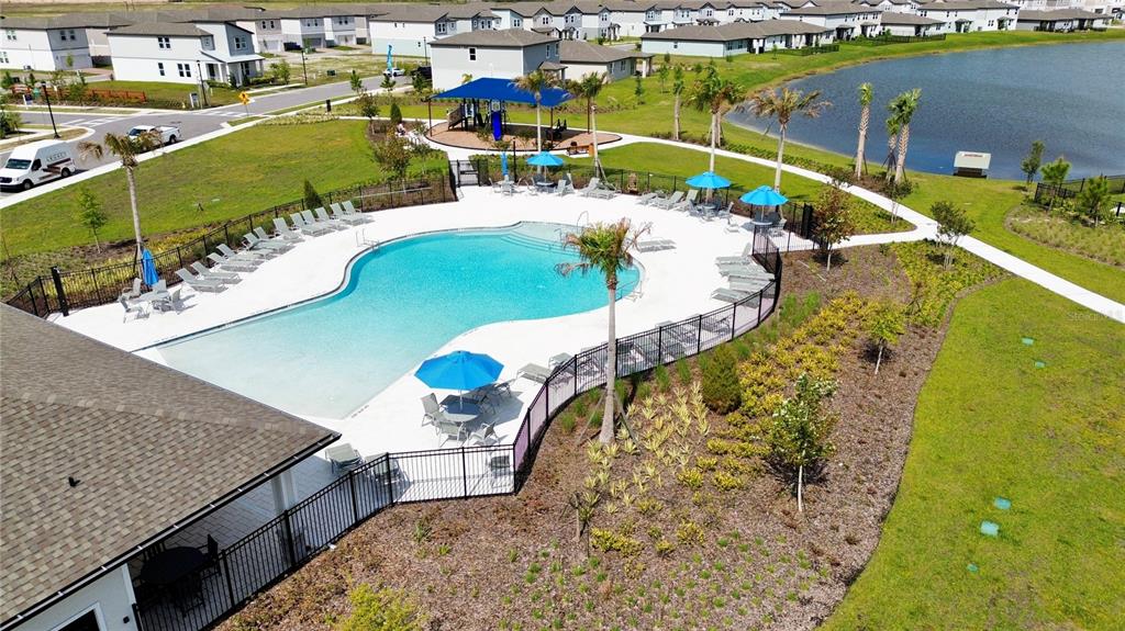 4348 Ranch House Road St. Cloud, FL 34772 - Photo 55 of 58 a view of swimming pool with a table and chairs