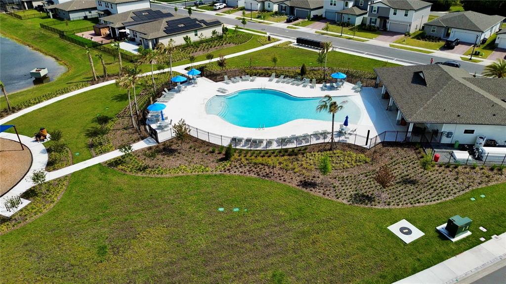 4348 Ranch House Road St. Cloud, FL 34772 - Photo 57 of 58 an aerial view of a house with a garden and swimming pool