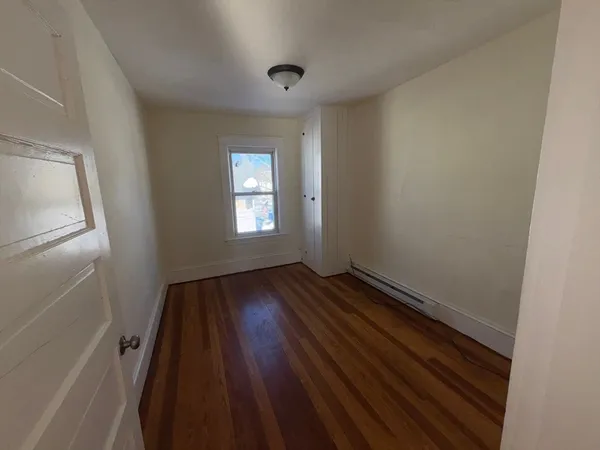 a view of an empty room and window