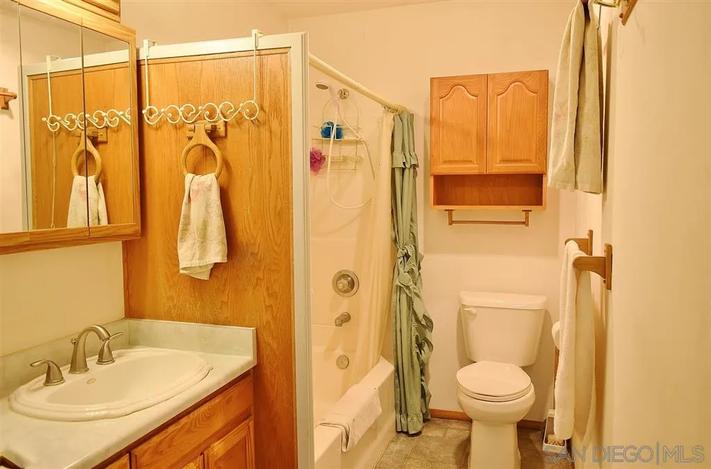 1852 Lilac Road Ramona, CA 92065 - Photo 11 of 25 a bathroom with a sink toilet and shower
