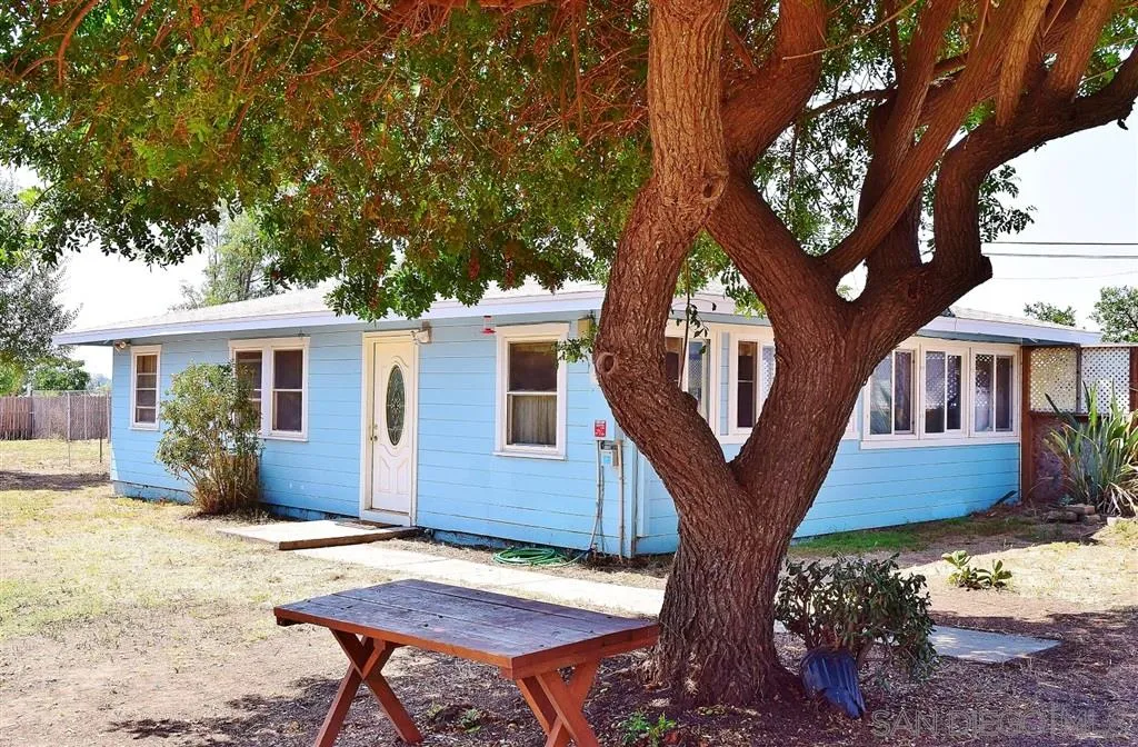 1852 Lilac Road Ramona, CA 92065 - Photo 2 of 25 a front view of a house with a tree
