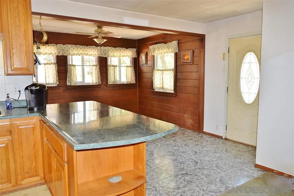 1852 Lilac Road Ramona, CA 92065 - Photo 7 of 25 view of a kitchen with a sink and a dishwasher next to a window
