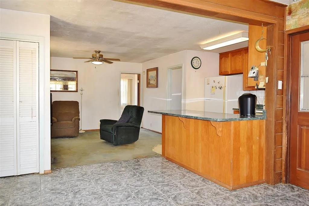 1852 Lilac Road Ramona, CA 92065 - Photo 8 of 25 a living room with furniture and a rug