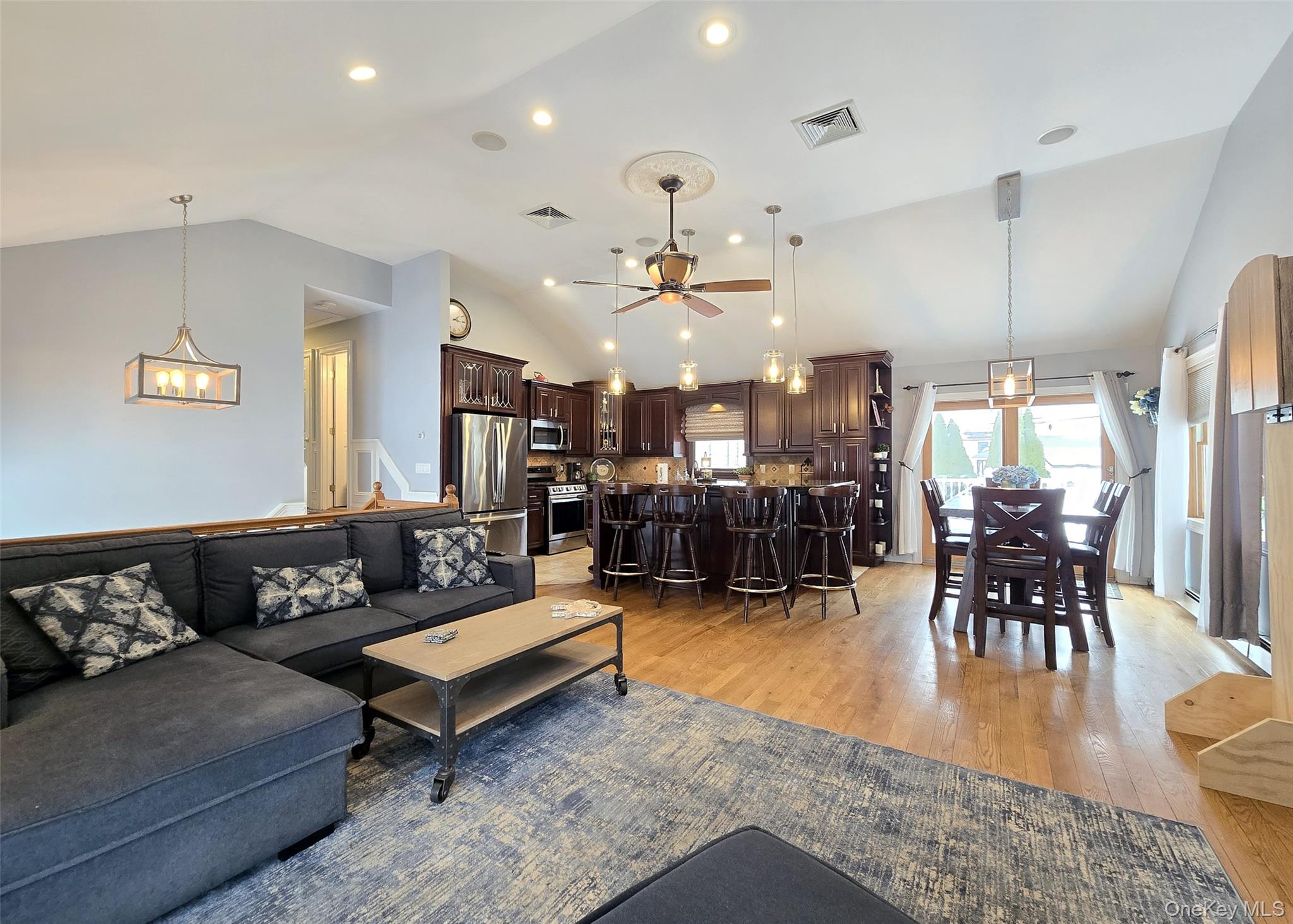 46 Harvest Lane Commack, NY 11725 - Photo 12 of 40 a living room with furniture and kitchen view