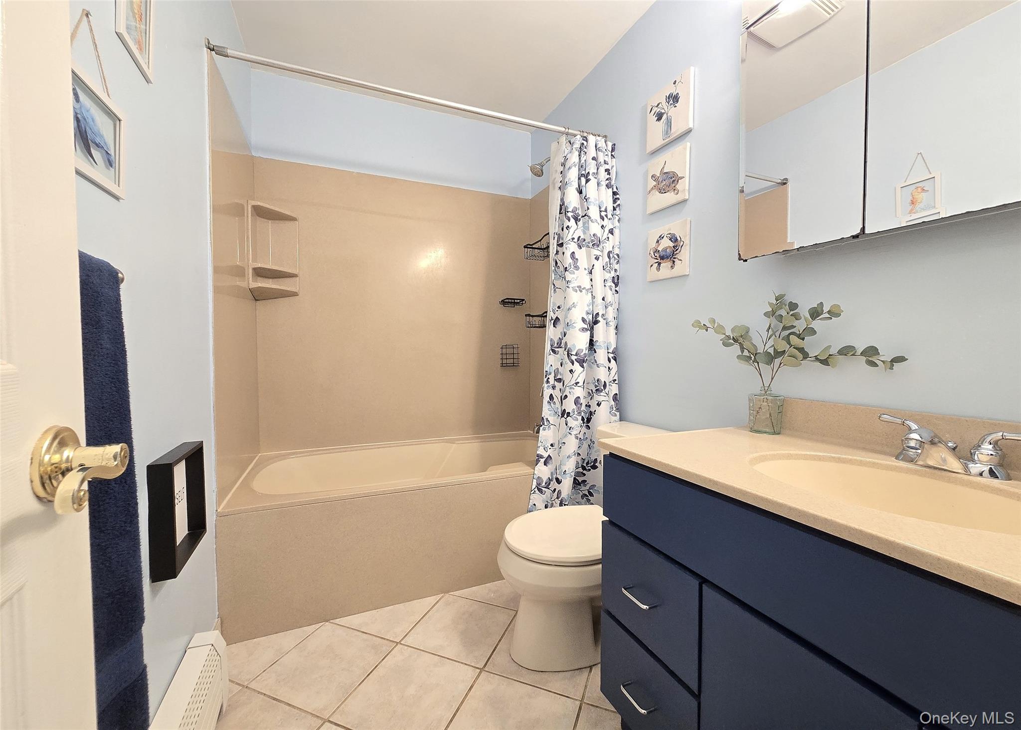 46 Harvest Lane Commack, NY 11725 - Photo 23 of 40 a bathroom with a sink a toilet and a bathtub