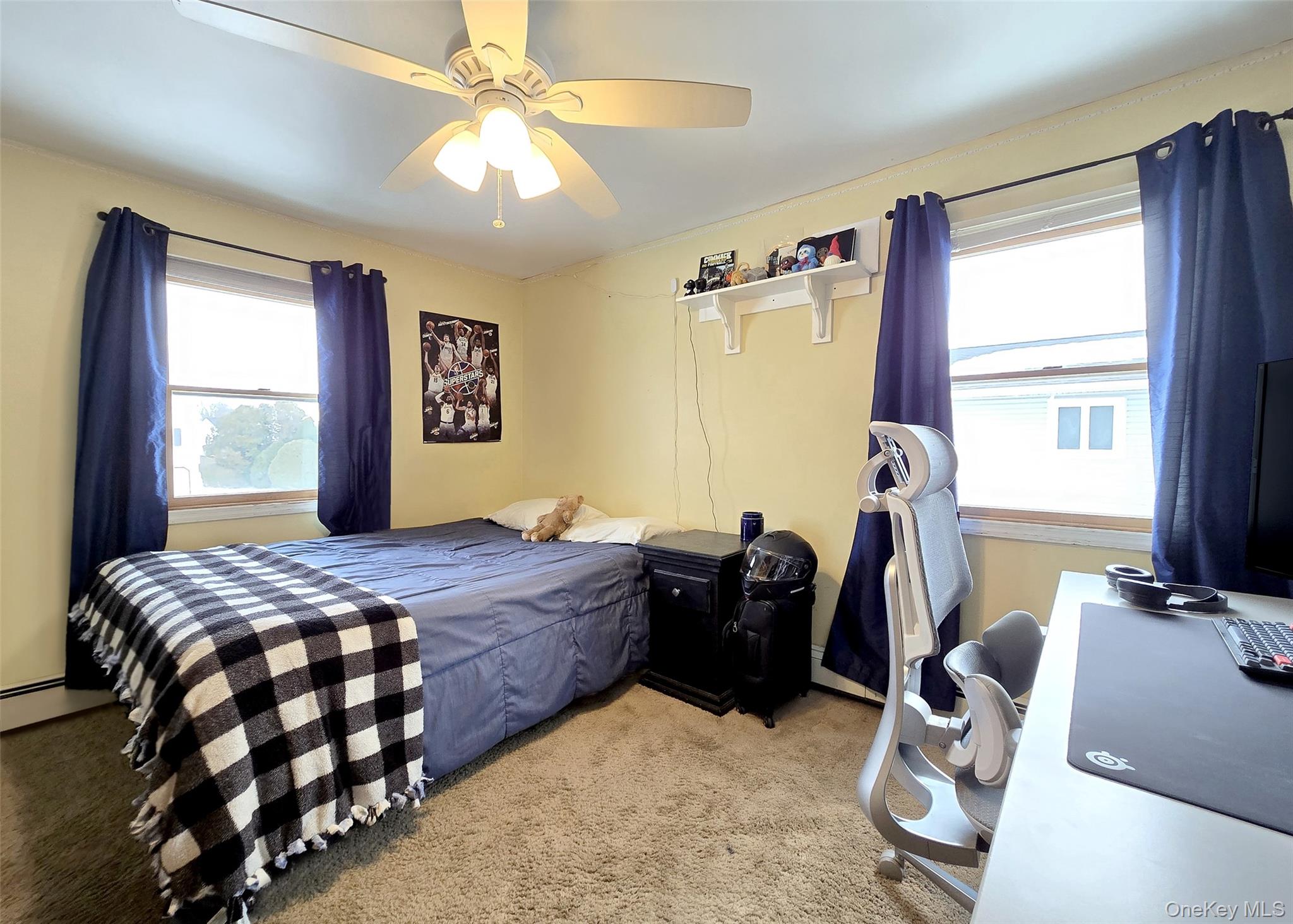 46 Harvest Lane Commack, NY 11725 - Photo 28 of 40 a bedroom with bed and window
