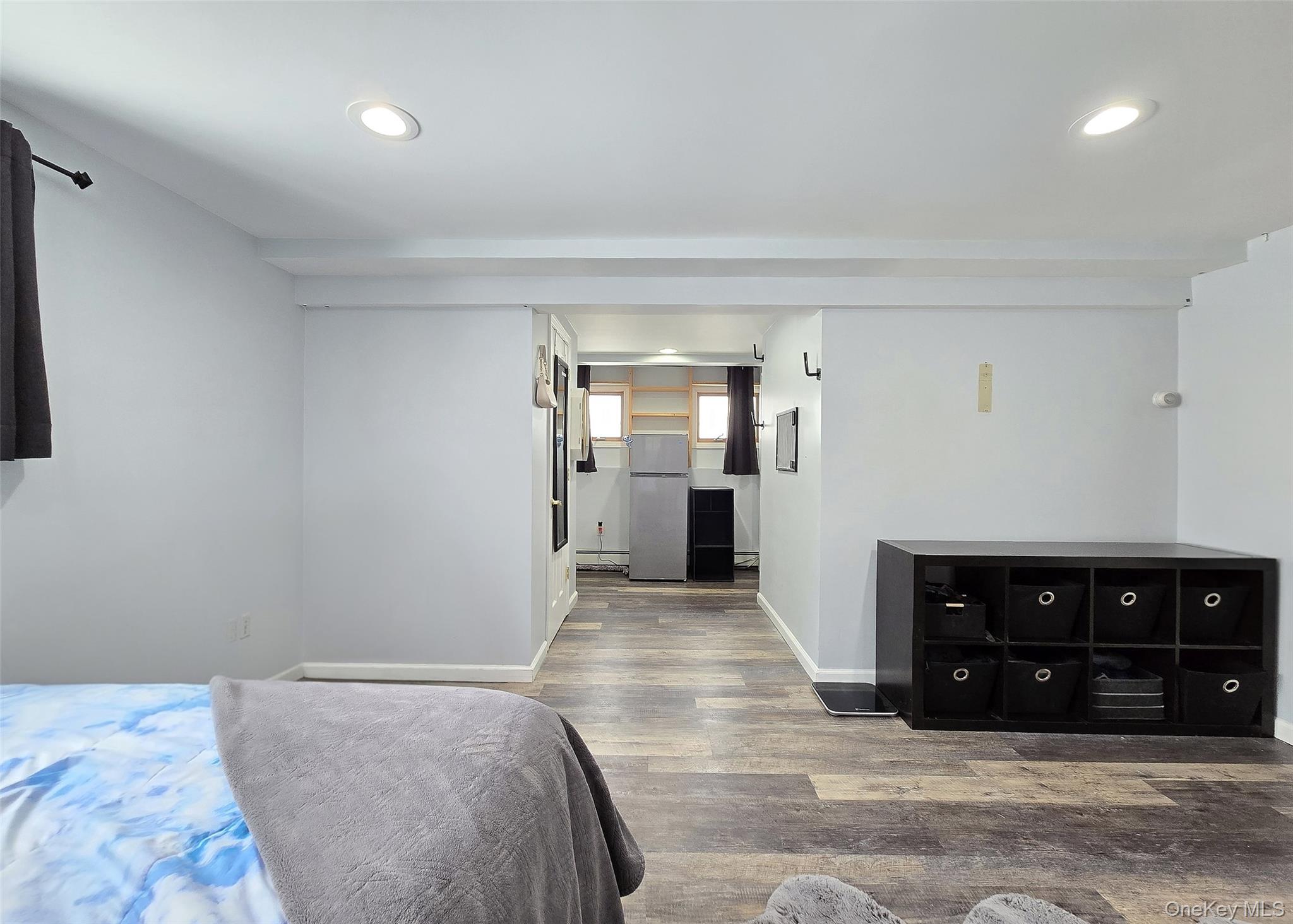 46 Harvest Lane Commack, NY 11725 - Photo 29 of 40 a spacious bedroom with a bed and a cabinets