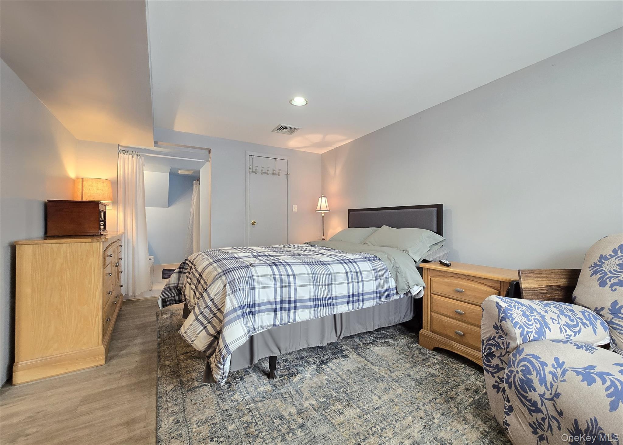 46 Harvest Lane Commack, NY 11725 - Photo 35 of 40 a bedroom with a bed and a couch