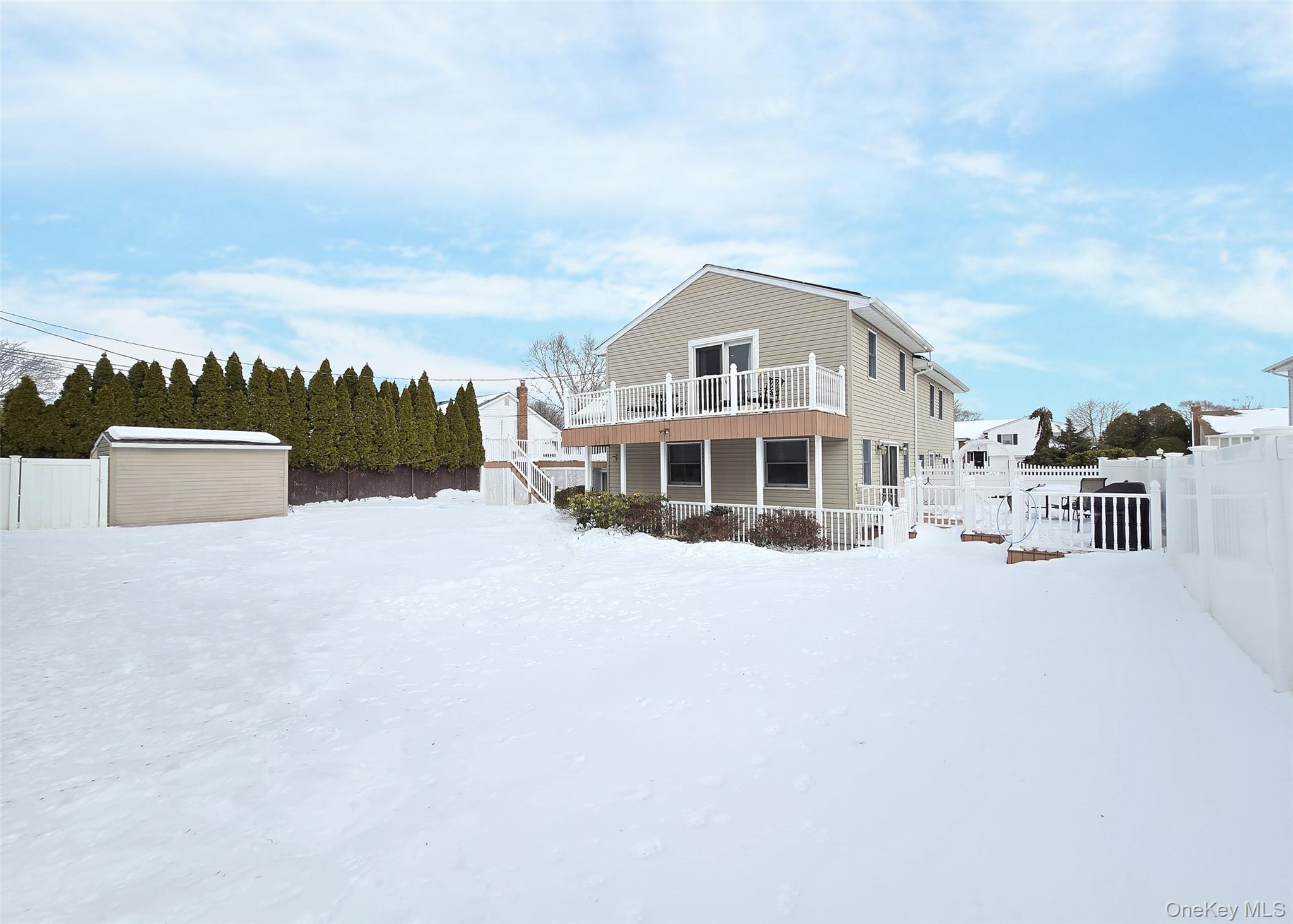 46 Harvest Lane Commack, NY 11725 - Photo 6 of 40 a front view of a house with a yard