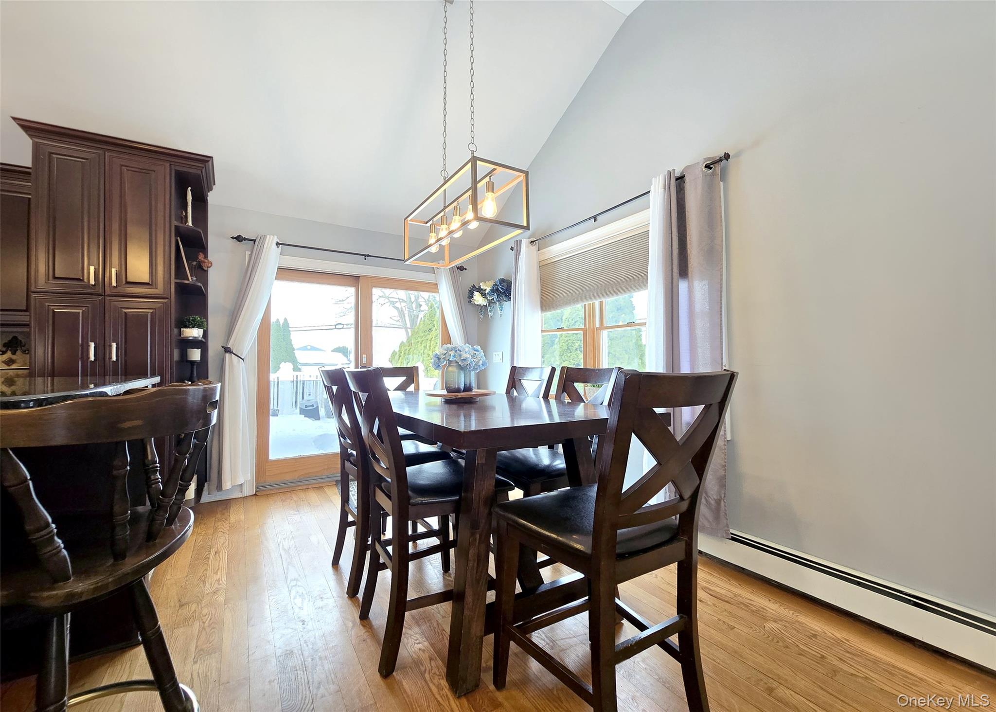 46 Harvest Lane Commack, NY 11725 - Photo 9 of 40 a view of a dining room with furniture window and wooden floor