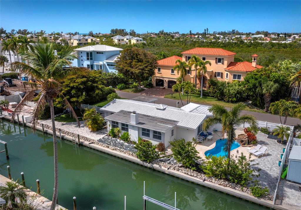 726 Jungle Queen Way Longboat Key, FL 34228 - Photo 2 of 43 an aerial view of residential houses with outdoor space and swimming pool