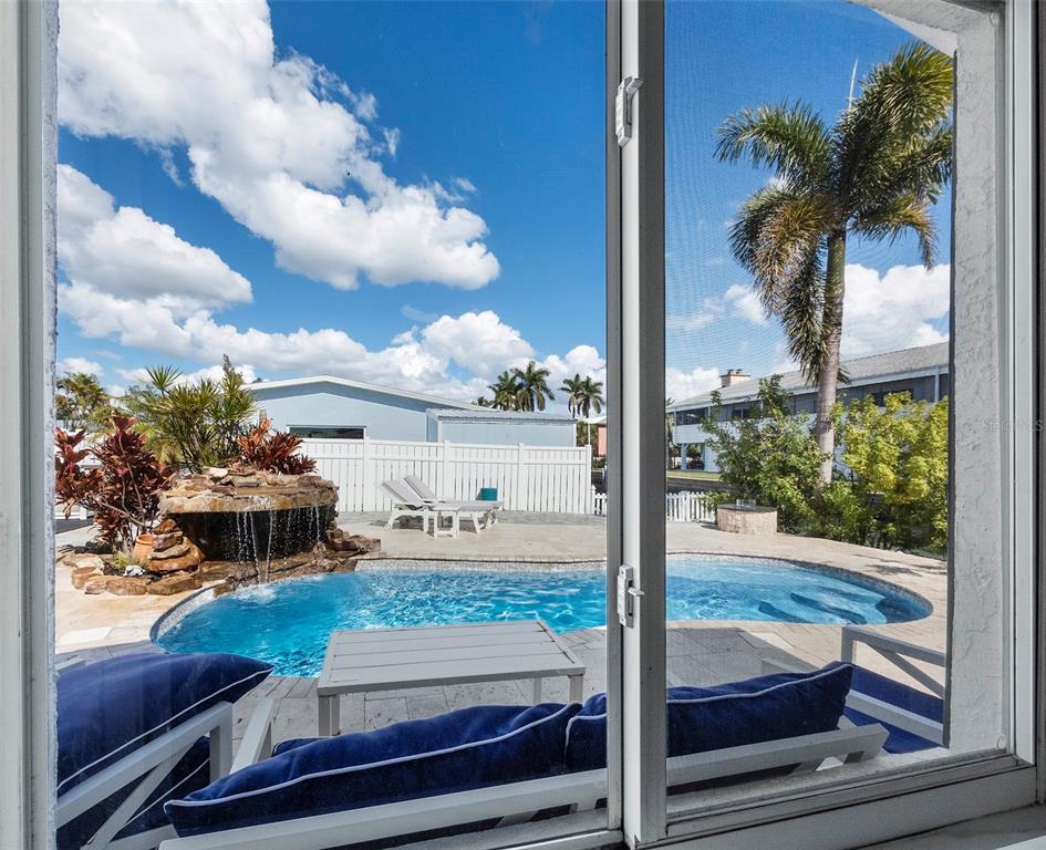 726 Jungle Queen Way Longboat Key, FL 34228 - Photo 21 of 43 a house view with a garden space