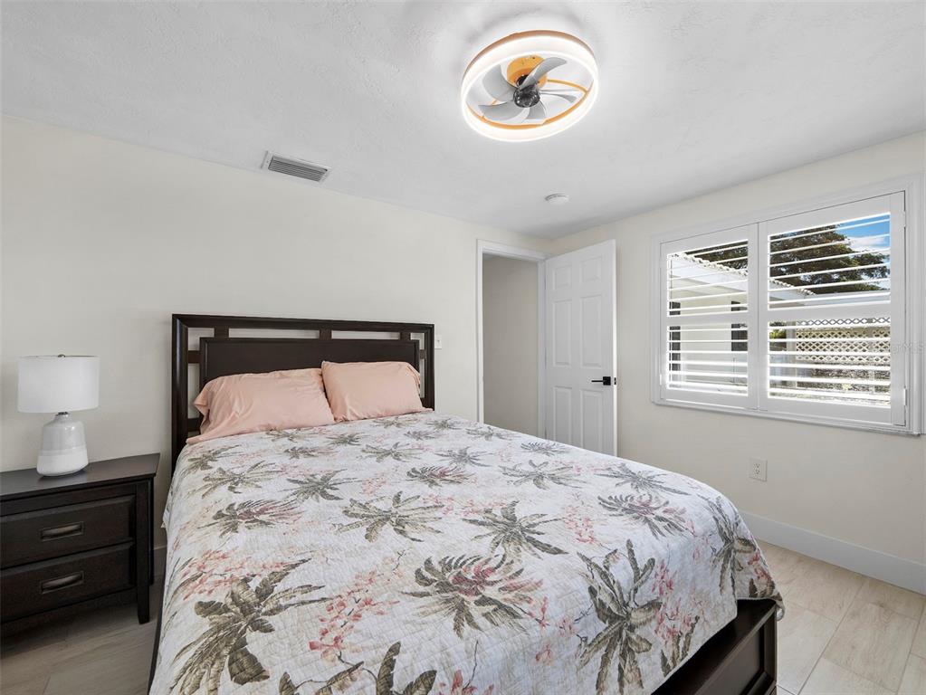 726 Jungle Queen Way Longboat Key, FL 34228 - Photo 23 of 43 a bedroom with a bed and a window