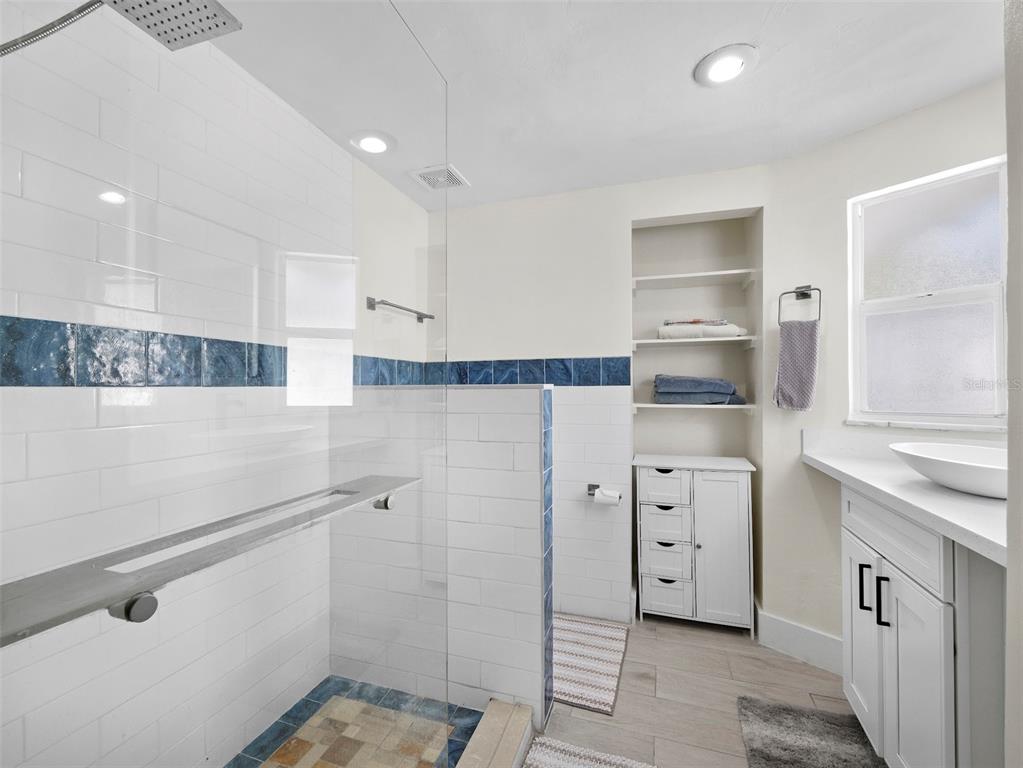 726 Jungle Queen Way Longboat Key, FL 34228 - Photo 24 of 43 a kitchen with white cabinets and refrigerator