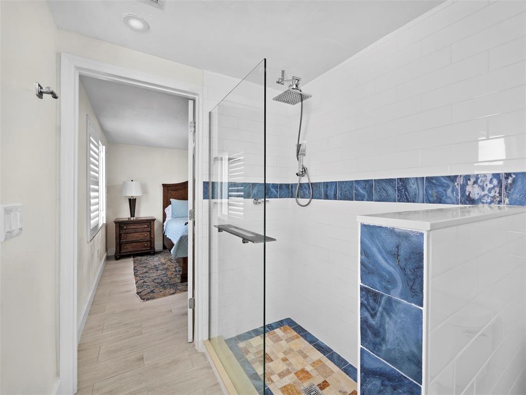 726 Jungle Queen Way Longboat Key, FL 34228 - Photo 26 of 43 a en suite bathroom with a shower